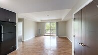 Located at 2895 Pauling Ave in Richland, WA, this well-appointed 2-bedroom, 4-bathroom residence offers a thoughtfully designed single-floor layout. The open living area features warm wood-style flooring and neutral tones, creating a bright and welcoming atmosphere. Large sliding glass doors lead to a private balcony, filling the space with natural light and offering pleasant views of surrounding greenery. The kitchen is a standout feature, equipped with two-tone cabinetry — dark lower cabinets paired with white uppers — granite-style countertops, under-cabinet lighting, and black appliances including a refrigerator, range, microwave, and dishwasher. The two bedrooms are finished with plush carpet and feature generous closet space, with the primary bedroom offering ample room for furnishings. The four bathrooms are clean and functional, with wood-style flooring, dark vanity cabinetry with granite-style countertops, and walk-in shower stalls. Three closets throughout the unit provide excellent storage. The consistent use of dark hardware and door finishes ties the design together, giving the space a cohesive, modern aesthetic throughout.