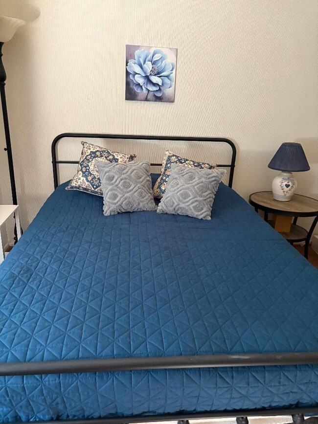 Queen-size bed has new mattress topper. - 20050 Dorothy St