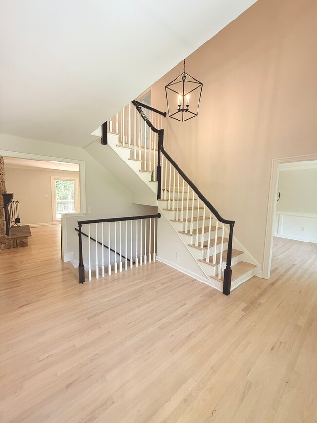 Entry foyer and stairs to both levels - 9248 Wood Glade Dr