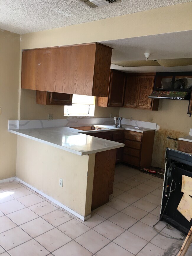 Kitchen with all new countertops and new stove range coming soon - 37 Fano St