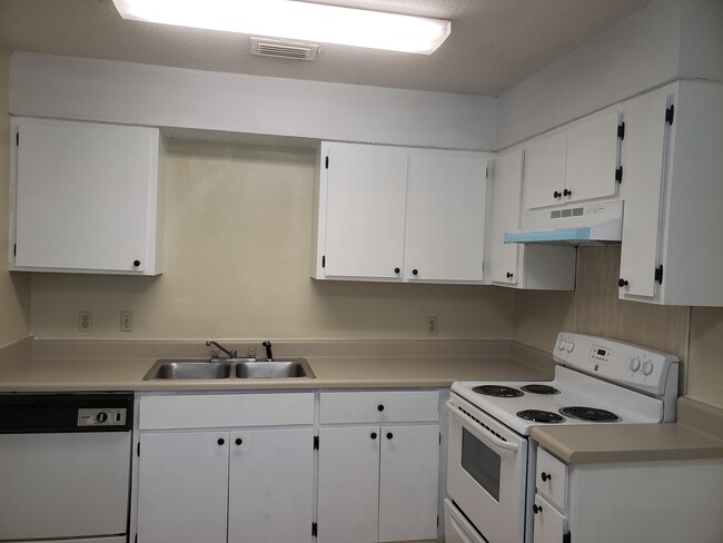 Kitchen updated with newly refinished cabinets and newly painted counter tops - 32A 5th St