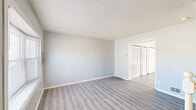 Located at 1108 City Ave in Atlantic City, NJ, this two-story home offers three bedrooms, two bathrooms, and a practical layout spread across two well-proportioned floors. The main level features a kitchen equipped with gray cabinetry, warm stone-toned countertops, and black appliances including a gas range and refrigerator, all set over light wood-style flooring. The living area continues the clean, neutral aesthetic with the same flooring and a bright, open feel.

Upstairs, the bedrooms are finished with soft carpet and light gray walls, creating a calm and comfortable atmosphere. The primary bedroom is generously sized and features double closet doors for ample storage. The additional bedrooms each include windows that bring in natural light and their own closet space. With a total of eight closets throughout the home, storage is a notable strength of this layout.

Both bathrooms are finished with tile flooring. One includes a full tub-shower combination with a white surround, while the other features a white vanity with under-sink storage and a wall mirror. Textured ceilings are consistent throughout the home. Two staircases, multiple hallways, and a dedicated utility room round out the functional layout of this well-organized Atlantic City residence.