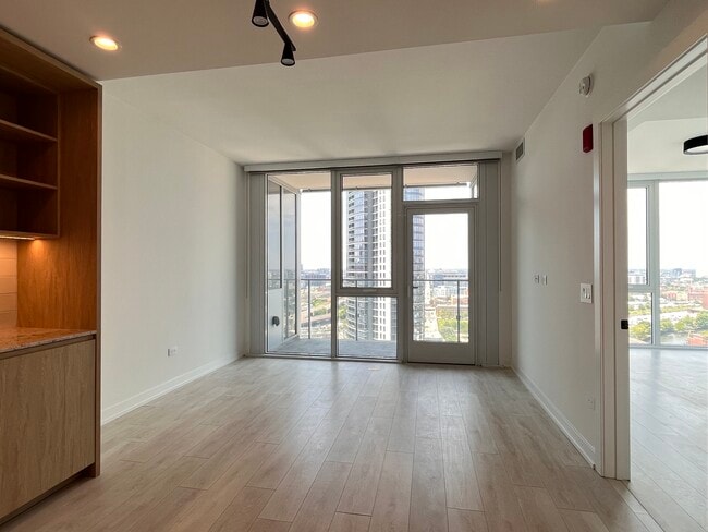 Living area with Balcony - 330 W Grand Ave