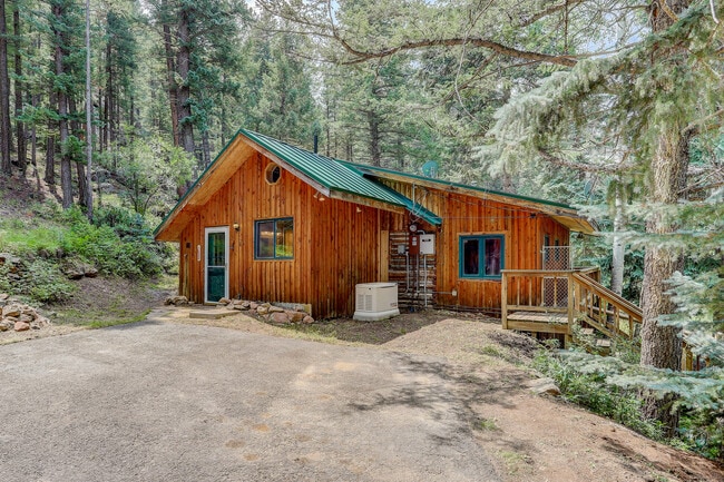 deck that wraps around North side to back yard, stairs to well house - 15 Ranch Trl