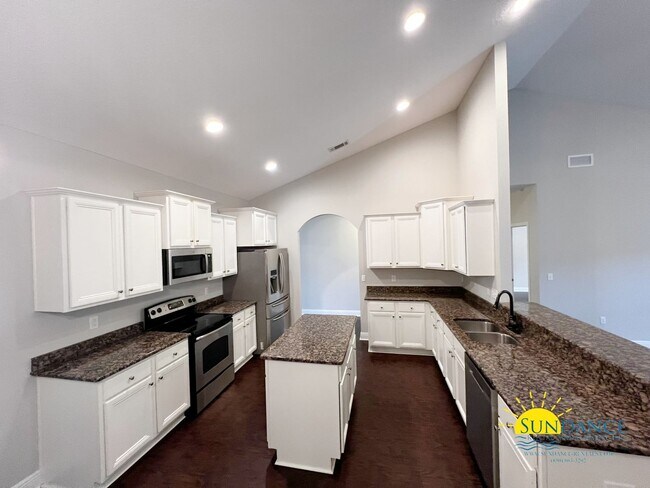 Building Photo - 4 Bedroom home with custom upgrades in the...