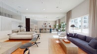 Located at 2132 City Gate Lane in Naperville, IL, this single-floor amenity space offers a thoughtfully designed, open-concept layout that seamlessly connects multiple functional zones within a bright, contemporary interior. Light-toned hardwood flooring and crisp white walls establish a clean, modern aesthetic throughout, while recessed lighting and oversized windows invite generous amounts of natural light into every corner.

The main lounge area is anchored by a sleek linear fireplace topped with a wall-mounted television, flanked by stylish lounge chairs and a substantial low-profile coffee table set atop a warm terracotta-toned area rug. Adjacent to this is a more intimate seating zone featuring a plush sofa and accent chairs framed by floor-to-ceiling neutral drapery that softens the abundant exterior views.

At the heart of the space, a striking central bar-height table with bold blue cylindrical legs and cushioned stools serves as a social gathering hub, complemented by a nearby dining area and a functional kitchen station along the perimeter. Lush potted tropical plants add warmth and life throughout.

Tucked toward the rear, semi-private banquette booths feature textured accent walls and intimate table settings, offering quieter nooks within the larger communal setting. Decorative artwork displayed in a gallery-wall arrangement adds a curated, residential character to the space overall.