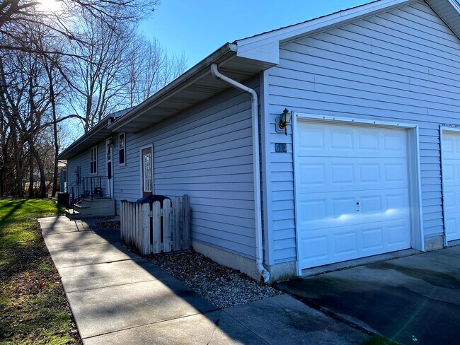 Attached garage and assigned driveway - 613 E Glover St