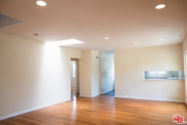 Part of dining room an opening to kitchen - 3864 Girard Ave