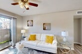 Located at 14531 Ella Blvd in Houston, TX, this well-appointed single-floor, one-bedroom, one-bathroom unit offers a thoughtfully designed layout that maximizes every square foot. The living room serves as the heart of the space, featuring wood-look flooring, a ceiling fan, and a sliding glass door that floods the room with natural light and opens directly onto a private patio with outdoor views. The dining area is positioned adjacent to the living room and is enhanced by a full-wall mirror that visually expands the space and reflects light throughout. The kitchen is efficiently laid out with white cabinetry, light countertops, an electric range with overhead ventilation, and a single-basin sink — complemented by a dedicated pantry for additional storage. The bedroom offers a comfortable and serene retreat, complete with its own ceiling fan, wood-look flooring, a closet, and clean neutral walls. The full bathroom includes a tub-shower combination, a single vanity with storage, and wood-look flooring that ties into the rest of the unit. A hallway connects the main areas, contributing to an organized and functional flow throughout the home. The overall ambiance is bright, clean, and understated.