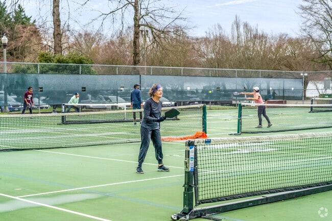 Phinney Ridge locals enjoy a game of Pickle Ball at Woodland Park courts.