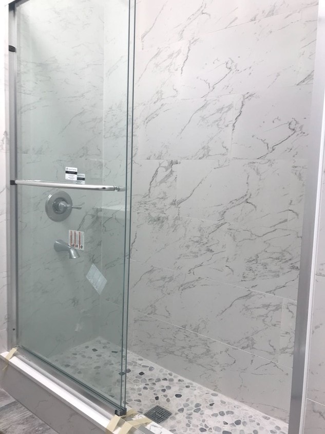 carrara tile, Delta fixtures - 1424 E Florida St