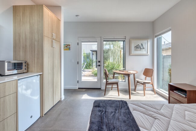Private entrance and patio leads into the studio with sheer and blackout shades for privacy. - 4711 N 14th St