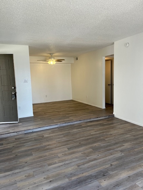 Empty living room/dining room (popcorn ceilings have been removed) - 6480 N 82nd St