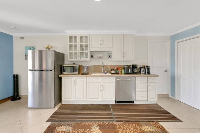 Full kitchen with stove, oven, dishwasher, refrigerator, and microwave. Also includes coffee machine - 32702 Seven Seas Dr