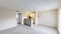 This single-story residence in Clute, TX offers 890 square feet of living space, efficiently designed with 3 bedrooms and 3 bathrooms. The home features a modern aesthetic with neutral tones throughout. The kitchen showcases white cabinetry, granite countertops, and stainless steel appliances, creating a sleek and functional cooking space. Bedrooms are carpeted for comfort, with the primary bedroom measuring 160 square feet. Bathrooms have been updated with granite vanity tops and modern fixtures. The living area is spacious, with plush carpeting and ample natural light from windows. Textured ceilings add character to the space. The hallway features durable wood-look flooring, connecting the various rooms seamlessly. Closet space is available for storage needs. The property's layout is thoughtfully designed to maximize the use of space, making it ideal for those seeking a compact yet comfortable living arrangement in the Clute area.