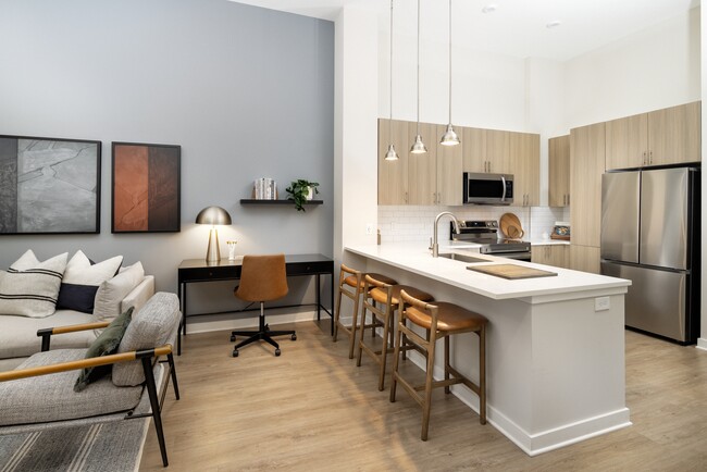 Kitchen and dining area with hard surface vinyl plank flooring - Avalon Durham