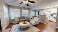 Located at 330 Cross Park Dr in Pearl, Mississippi, this single-story, 3-bedroom, 2-bathroom home offers a well-designed layout that balances comfort and functionality. Rich hardwood flooring flows throughout the main living areas, lending warmth and continuity to the space. The living room serves as the heart of the home, highlighted by a tile-surround fireplace, a ceiling fan with a light fixture, and multiple windows that fill the room with natural light. The open layout connects the living area seamlessly to a dedicated dining space, ideal for everyday meals or entertaining. The kitchen features white cabinetry, marble-style countertops, a peninsula with seating, and bright overhead lighting, creating a clean and efficient workspace. The spacious primary bedroom boasts vaulted ceilings, large windows, and plush carpeting, offering a tranquil retreat. Two additional bedrooms, each carpeted and naturally lit, provide comfortable accommodations. The bathrooms are finished with white cabinetry and marble-style countertops, maintaining a cohesive aesthetic throughout. Two closets and a dedicated entrance further enhance the practicality of this thoughtfully laid-out home. Neutral tones and textured ceilings are consistent throughout, giving the space a cohesive, move-in-ready feel.
