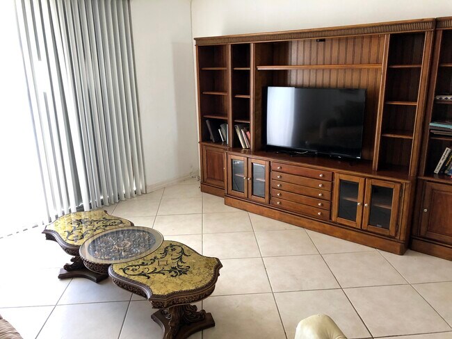 Living Room (wall unit and large flat screen TV) - 7900 Tatum Waterway Dr
