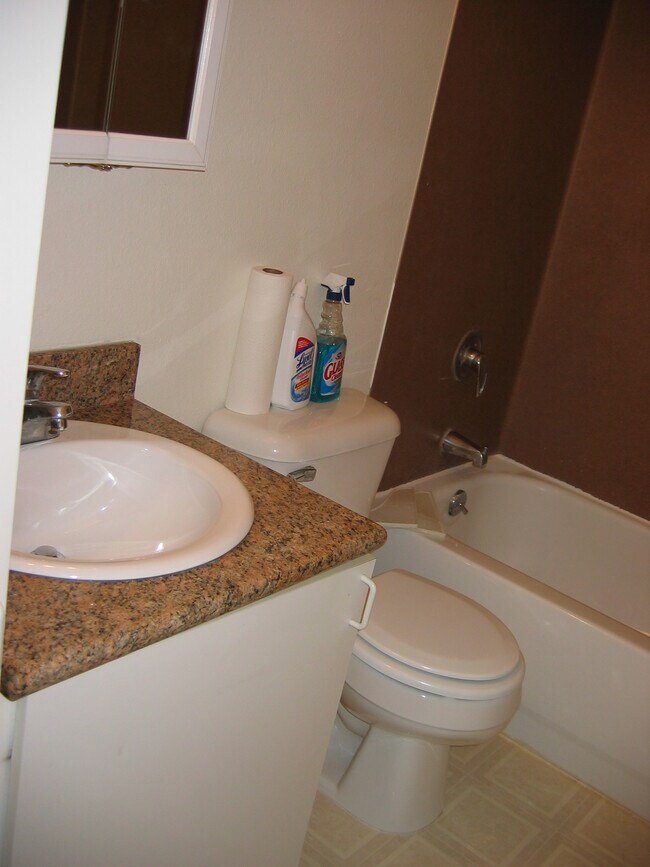 full bathroom w granite counter and newly refinished tub - 12741 35th Ave NE