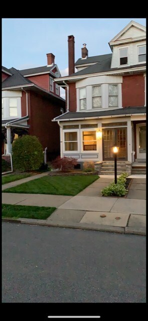 Front with covered porch, great for catching concerts or watching the snow fall! - 708 8th Ave