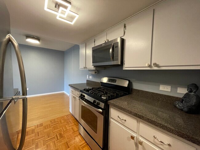 Kitchen with Stainless Steel Appliances - 8200 Woodglen Ln