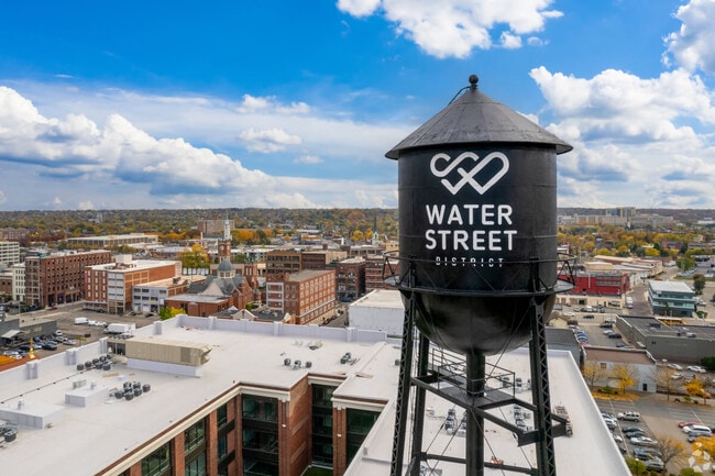 A water tower stands over Downtown Dayton.