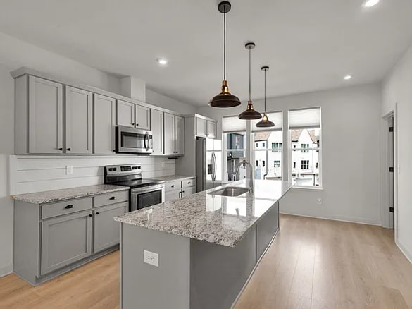 Open concept w/large island - 339 E Village Ln Townhome