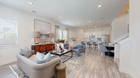 Located at 3800 W Lamberth Rd in Sherman, TX, this well-designed two-story home offers 3 bedrooms, 4 bathrooms, a dedicated office, and a laundry room across two thoughtfully laid-out floors. The main floor centers around a bright, open-concept living and kitchen area finished with light wood-look flooring throughout. The kitchen features crisp white cabinetry, stainless steel appliances, a central island with pendant lighting, and bar seating — flowing seamlessly into the living and dining areas, which are filled with natural light from multiple windows. Upstairs, the more expansive floor houses the bedrooms, including a generous primary suite with plush carpeting, large windows, and a ceiling fan. Additional bedrooms are carpeted and bright, with ample closet space. The dedicated office provides a quiet, windowed retreat with carpet flooring. Four full bathrooms are distributed across both floors, each finished with white cabinetry, quartz-style countertops, and wood-look tile flooring. A full laundry room with side-by-side washer and dryer hookups adds everyday convenience. The home's clean, neutral palette and modern finishes create a cohesive, move-in-ready aesthetic throughout.