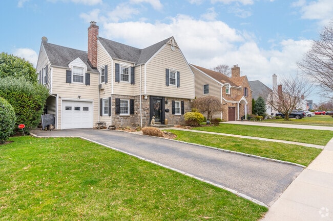 Multi-story colonials and well-manicured lawns adorn the streets of Garden City.