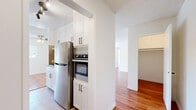 Located in the heart of Los Angeles, this 2-bedroom, 2-bathroom residence on South Almont Drive offers a thoughtfully designed single-level layout with a bright, cohesive aesthetic throughout. Warm hardwood flooring flows seamlessly across the living areas and bedrooms, complemented by clean white walls and textured ceilings that add character to each room. The kitchen is well-appointed with white shaker cabinetry reaching to the ceiling, stainless steel appliances including a refrigerator and built-in wall oven, and tile flooring, blending functionality with a modern finish. It opens conveniently toward the dining and living areas, creating a connected, open feel. The living room is generously proportioned, filled with natural light from large windows and a sliding glass door that leads to a private balcony, offering a seamless indoor-outdoor connection. A ceiling fan adds comfort to the space. Both bedrooms are well-sized, with the primary bedroom featuring direct access to a dedicated closet and en-suite bathroom. Bedrooms include mirrored sliding closet doors that enhance the sense of space. The bathrooms are clean and functional, featuring tile flooring, white vanity cabinetry with granite-style countertops, and a shower-tub combination. With five closets total spread throughout the home, storage is plentiful.