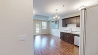 Located at 570 Park Avenue West in Chatham-Kent, Ontario, this thoughtfully designed 1-bedroom, 1-bathroom unit offers a functional and modern living experience across a single floor. Warm hardwood-style flooring flows throughout the space, creating a cohesive and inviting ambiance.

The kitchen is a standout feature, showcasing rich dark wood cabinetry with sleek hardware, granite-style countertops, a classic white subway tile backsplash, and a full suite of stainless steel appliances including a refrigerator, electric range, built-in microwave, and dishwasher. An elegant chandelier adds a refined touch to the open kitchen and living area.

The bedroom is a comfortable, well-lit retreat with a large window that allows natural light to pour in and provides views of the surrounding neighbourhood and mature trees.

The bathroom is finished with a white vanity featuring granite-style countertops, a full tub-shower combination with a built-in surround, and consistent hardwood-style flooring.

A dedicated laundry room includes a full-size washer and dryer, upper cabinetry for storage, and an electrical panel — offering excellent in-suite convenience. Windows throughout the unit offer pleasant outdoor views of greenery and open sky.