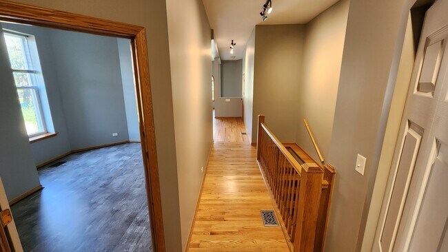 2nd BR on left, hallway facing front of building, stairs to lower level on right - 6126 S University Ave