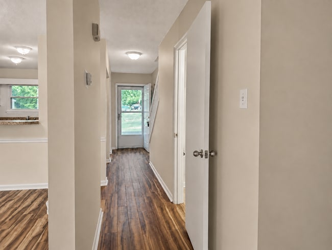 Downstairs hallway looking at front door. - 5484 Pine Top Cir