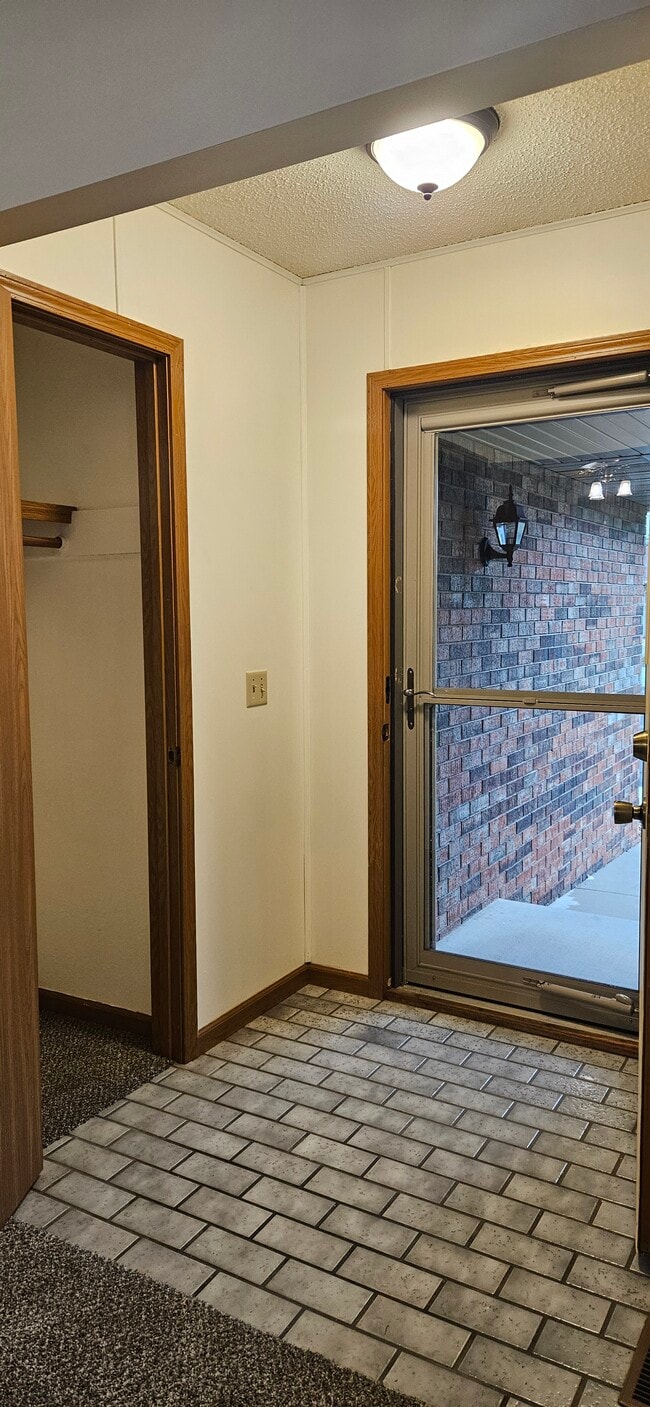 Front door and coat closet - 117 Grand Prairie Dr