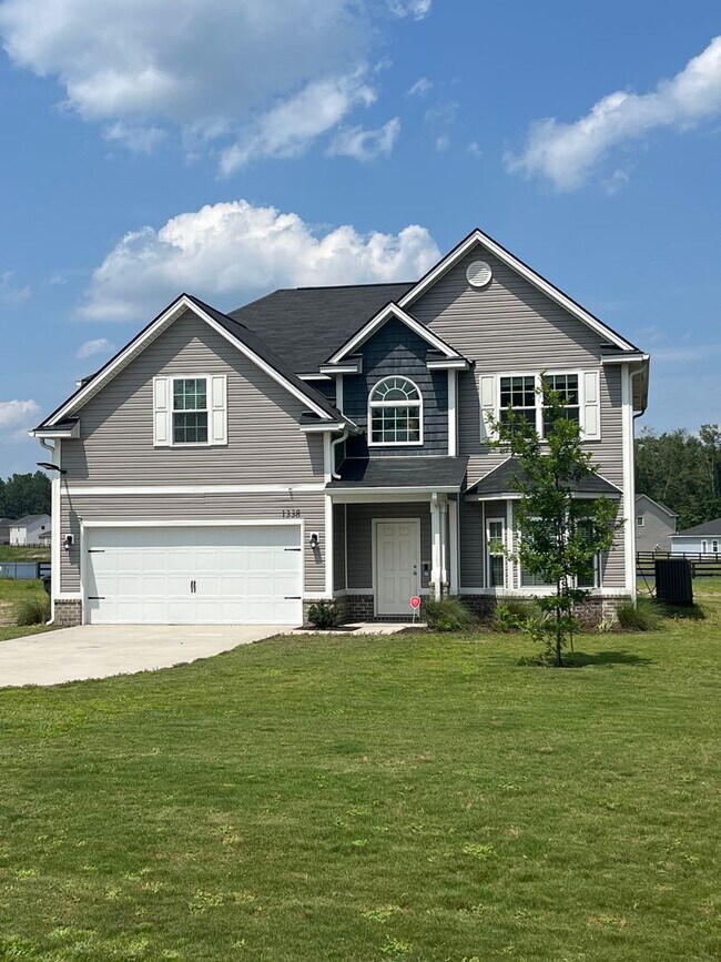 Building Photo - Spacious 4-Bedroom Pet Friendly Home with a Serene View - Available for Rent!