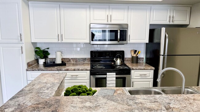 Our kitchens are spacious and stylish, boasting ample storage options, including a built-in pantry. - Indigo Isles