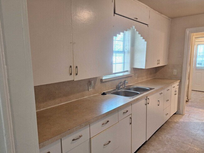 Building Photo - Affordable 2-1 Home with fenced in Back Yard