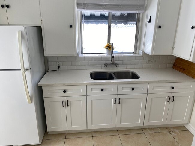 Newly renovated kitchen cabinets and countertops - 11280 Morrison St
