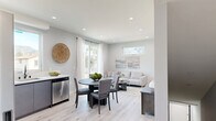 Located at 13615 Fellows Ave in Sylmar, Los Angeles, this contemporary three-story home offers four bedrooms, three bathrooms, and a thoughtfully designed layout spread across three levels. The entry level provides a compact yet functional footprint, while the two upper floors deliver the majority of the living space.

The main living floor features an open-concept kitchen and living room bathed in natural light. The kitchen is appointed with sleek grey cabinetry, white quartz countertops, stainless steel appliances, a matte black faucet, and a picture window framing picturesque mountain views. The adjoining dining and living areas flow seamlessly, with light hardwood-style flooring and recessed lighting throughout creating a bright, cohesive atmosphere.

Each of the four bedrooms is finished with the same light flooring and neutral palette, offering a calm and restful environment. Bedrooms feature mirrored sliding closets, high clerestory windows for added light and privacy, and sliding glass doors opening to private balconies. The primary bedroom provides a comfortable, well-proportioned retreat.

The three bathrooms are clean and modern, featuring floating grey vanities, framed mirrors, and glass-enclosed tub-shower combinations with white tile surround. A dedicated laundry area and multiple hallways and staircases ensure practical circulation throughout all three floors. Three balconies offer outdoor access and views across the neighborhood.