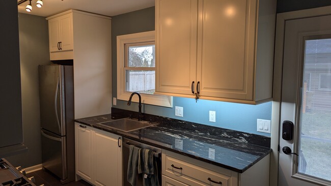 galley kitchen, facing backyard granite countertops - 5310 Camden Rd