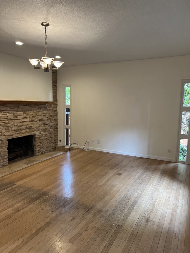 Living Room with hardwood floors and gas fireplace - 14212 SE River Rd