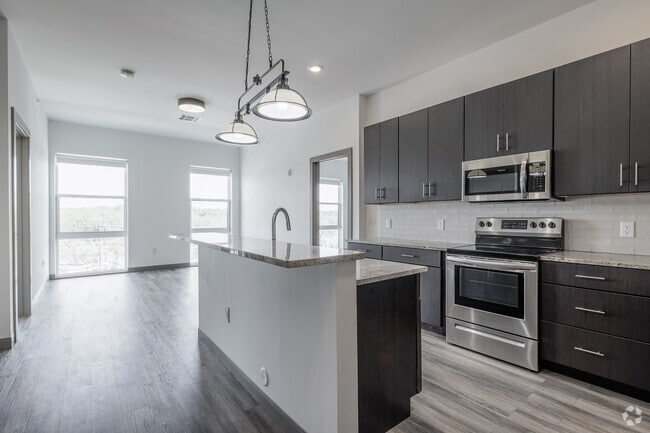 2BR, 2BA - 1,052SF - Kitchen and Living Room - Crossroads 389