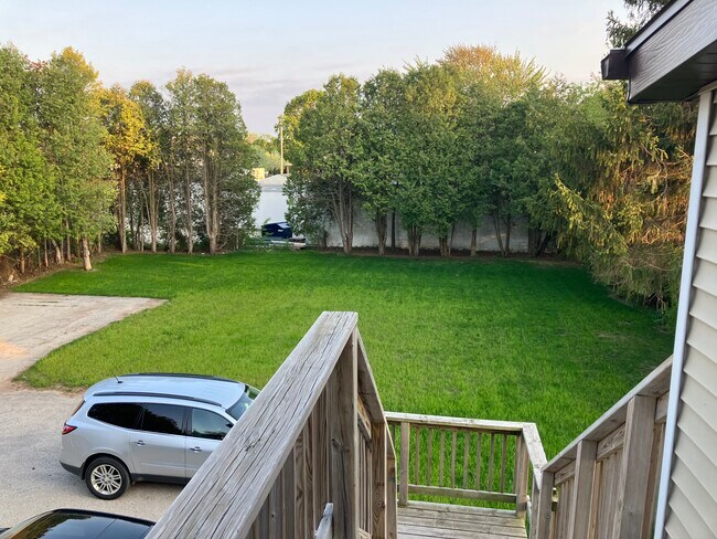 View of the backyard from your door. - 13 W Center Ave