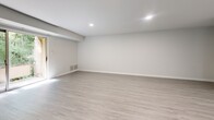 Located at 6718 Havenoak Rd in Rosedale, MD, this thoughtfully updated 2-bedroom, 2-bathroom unit offers a modern and functional layout across a single floor. Light-toned vinyl plank flooring runs throughout, creating a cohesive, clean aesthetic in every room.

The kitchen is a standout feature, equipped with a full suite of stainless steel appliances including a refrigerator, gas range, microwave, and dishwasher. Gray shaker-style cabinetry pairs with a white herringbone tile backsplash and a central island topped with a bright white countertop, illuminated by stylish pendant lighting overhead.

The open living area adjacent to the kitchen provides generous space for everyday use, with recessed lighting and neutral walls that make the room feel bright and airy. Both bedrooms are well-proportioned, featuring the same light flooring and large windows that allow natural light to filter in. The spacious primary bedroom includes direct access to one of the two bathrooms.

The bathrooms are cleanly designed; one features a tub/shower combination adorned with elegant white herringbone tile and matte black fixtures, adding a refined, modern touch. The unit also includes a closet and a dedicated laundry area, contributing to practical day-to-day functionality. Overall, this space presents a fresh, move-in-ready interior with consistent modern finishes throughout.