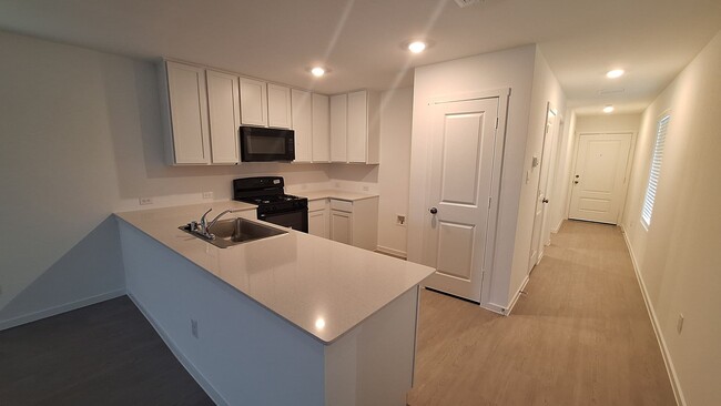 Building Photo - Townhome features 4 bedrooms and 2.5 bathr...