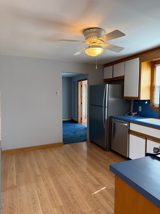 Kitchen opening to dining room - 87 Auburn St
