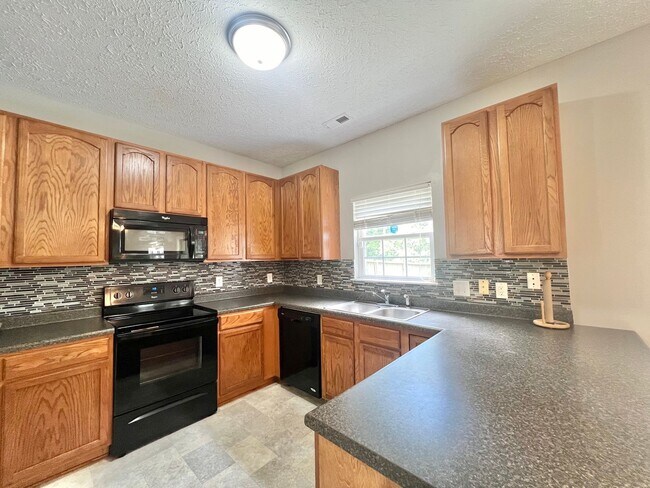 Building Photo - Charming 4BD, 2.5BA Durham Home with a Bonus Sun-Room & Fenced In Yard Only 10 Minutes Away from ...