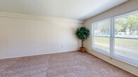Located at 331 Preston Ave in Voorhees, NJ, this three-bedroom, one-bathroom residence offers a practical and comfortable single-floor layout. The living room is a bright, open space featuring plush carpeting and multiple windows that flood the room with natural light and offer pleasant outdoor views of the surrounding greenery. Adjacent to the living area, the dining room provides a defined space for meals and entertaining.

The kitchen is a functional highlight of the home, featuring light wood cabinetry, dark granite-style countertops, a stylish mosaic tile backsplash, hardwood flooring, and stainless steel appliances including a refrigerator, dishwasher, and range.

Three carpeted bedrooms offer comfortable retreats, each with natural light from well-placed windows. The spacious primary bedroom includes crown molding and a generous closet, while the additional bedrooms provide ample room for various needs. Throughout the home, five closets offer abundant storage. A central hallway connects the bedrooms to the shared full bathroom. The overall ambiance is clean and neutral, with soft tones and carpet throughout the living spaces creating a warm, move-in-ready atmosphere.