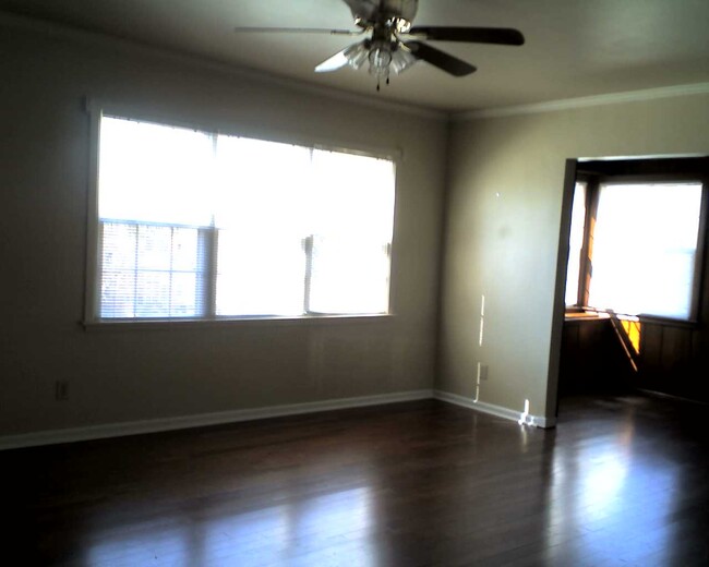 knotty pine sunroom from living room - 119 E 26th St