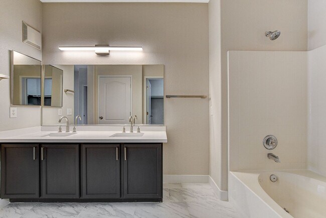 Building Photo - Upgraded First-Floor Condo in a Gated Summ...